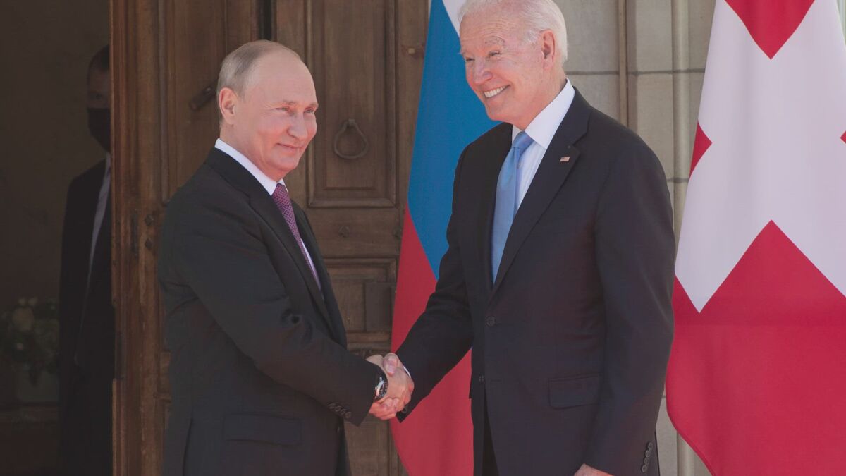 Russian President Vladimir Putin and President Biden shaking hands