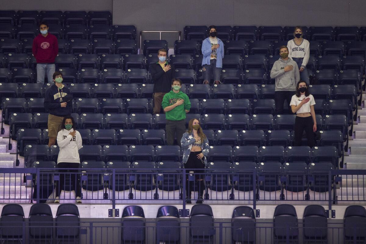 Limited number of Notre Dame students cheer.