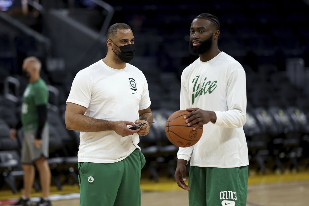 Boston Celtics guard Jaylen Brown, right, speaks with coach Ime Udoka during NBA basketball practice in San Francisco, Wednesday, June 1, 2022. The Golden State Warriors are scheduled to host the Celtics in Game 1 of the NBA Finals on Thursday. (AP Photo/Jed Jacobsohn)