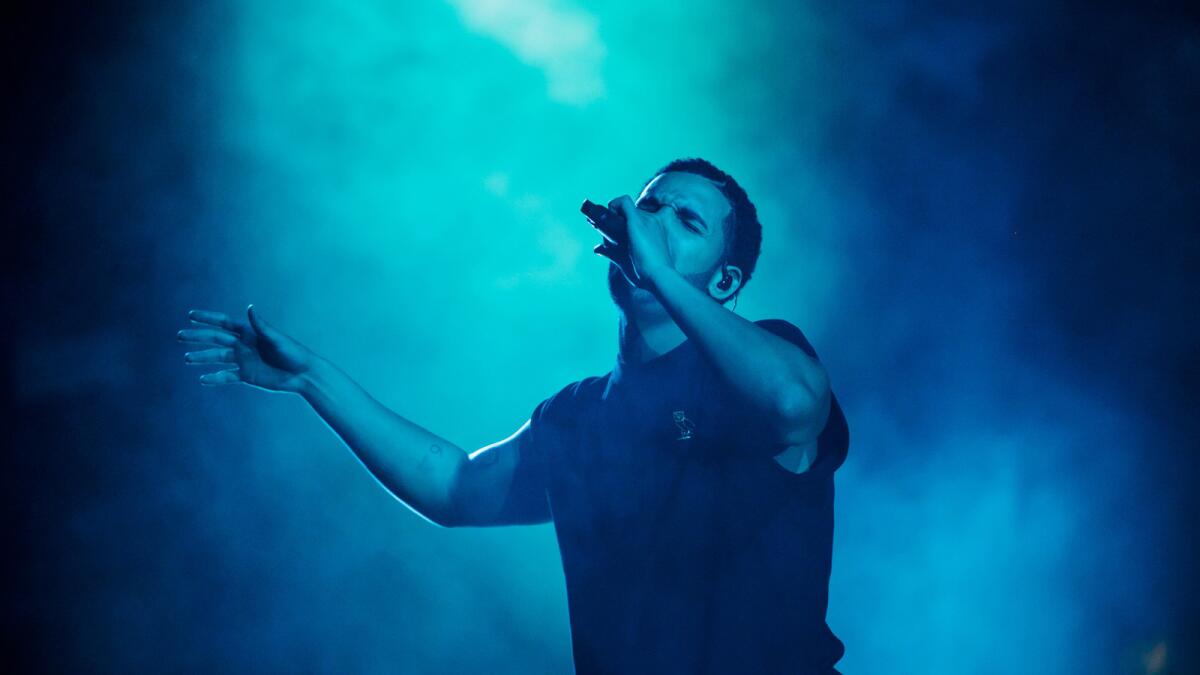 Drake performs on the main stage during the third day of Coachella.