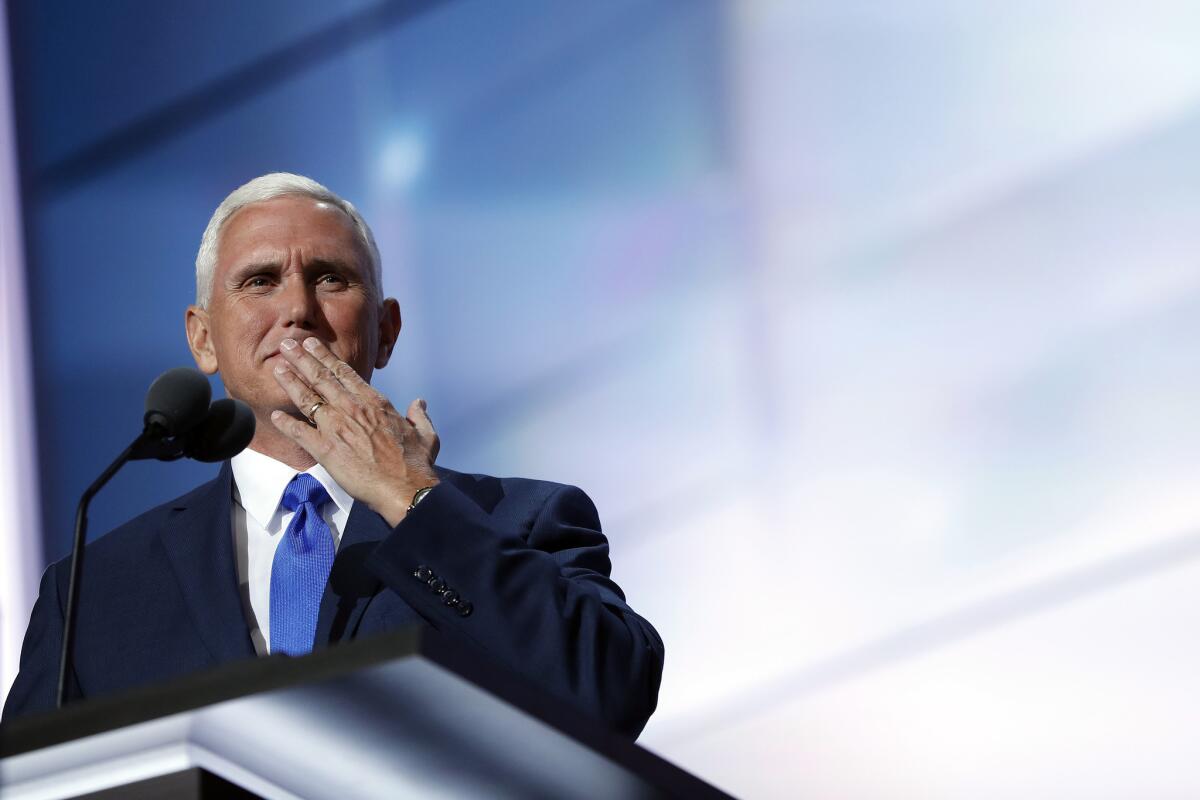 Gov. Mike Pence of Indiana blows a kiss to his wife as he speaks on the third day of the Republican National Convention in Cleveland.