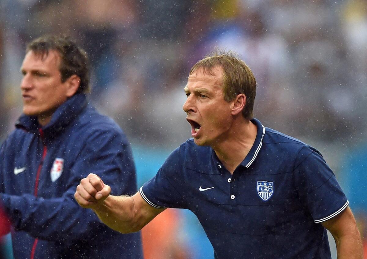 U.S. Coach Juergen Klinsmann directs his team during a 1-0 loss to Germany on Thursday. The U.S. advanced to the round of 16 over Portugal based on goal differential.