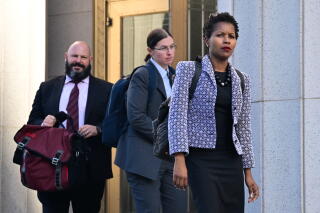 three people leave the Los Angeles Superior Court