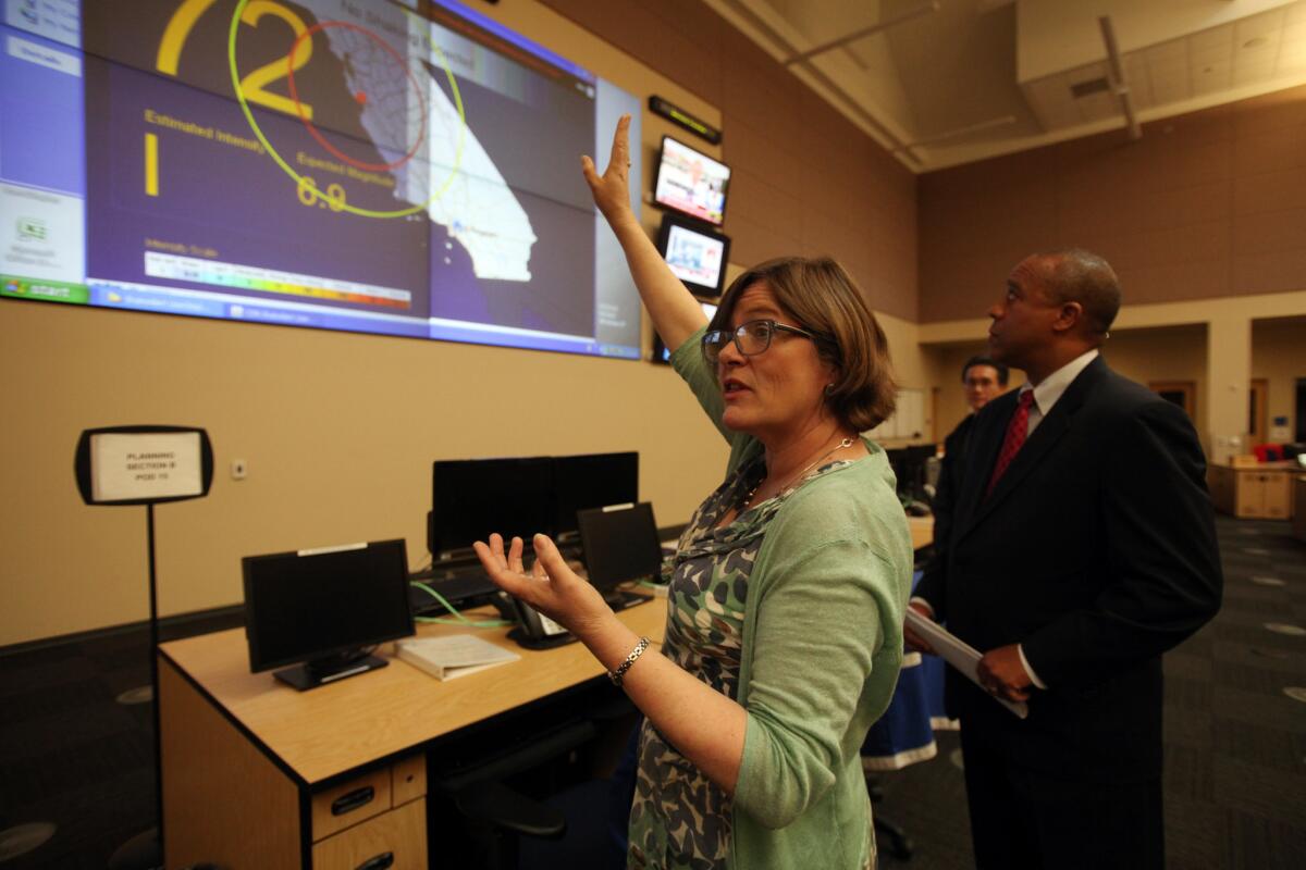 Lucy Jones of the U.S. Geological Survey and James G. Featherstone, general manager of Los Angeles' Emergency Management Department, explain how the early earthquake warning system works Friday.