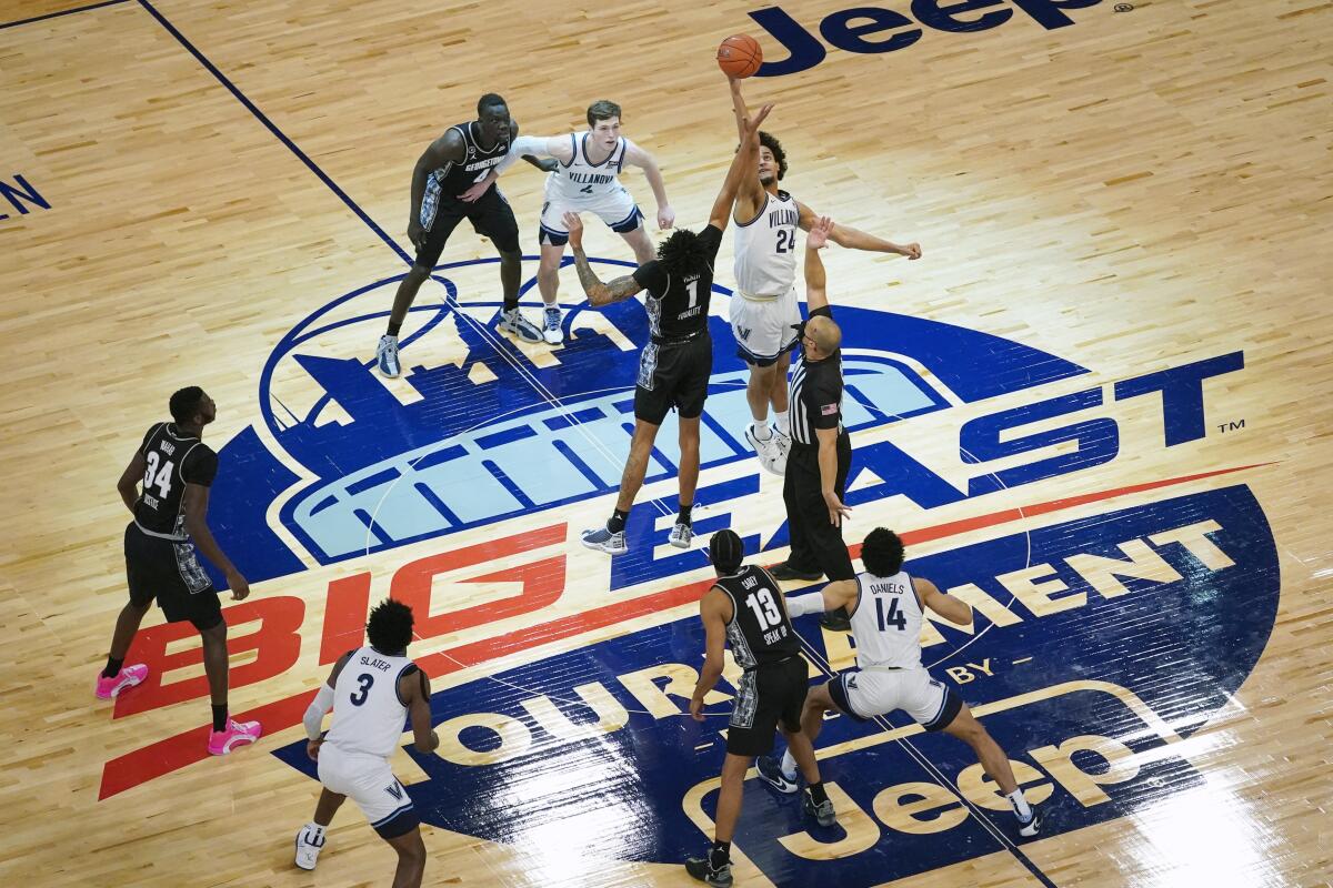 Villanova forward Jeremiah Robinson-Earl and Georgetown forward Jamorko Pickett tip off.