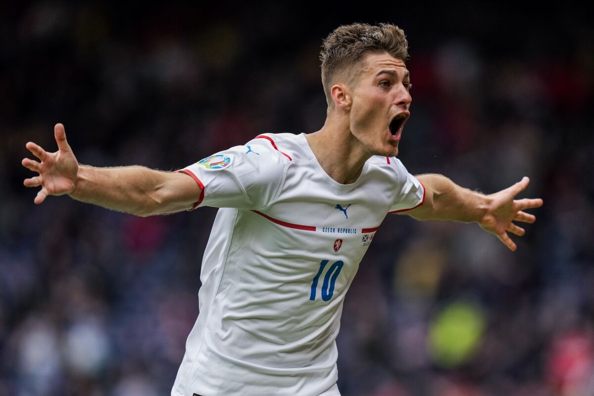 FILE- Czech Republic's Patrik Schick celebrates after scoring his second goal during the Euro 2020 soccer championship group D match between Scotland and Czech Republic, at Hampden Park stadium in Glasgow, Scotland, Monday, June 14, 2021. Patrik Schick was included in the Czech Republic squad for next week's 2022 World Cup qualifying playoff against Sweden that will be played on March 24, 2022. (AP Photo/Petr David Josek, Pool, File)