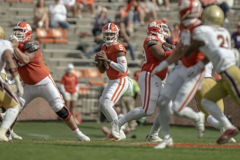 Clemson quarterback D.J. Uiagalelei (5) drops back to pass during the first half of an NCAA college football game against Boston College Saturday, Oct. 31, 2020, in Clemson, S.C. (Josh Morgan/Pool Photo via AP)