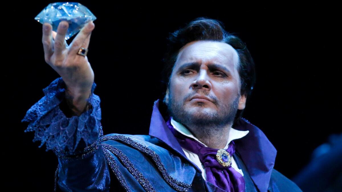 Bass-baritone Nicolas Testé lost his voice on opening night of L.A. Opera's production of "The Tales of Hoffmann," but performed onstage anyway, lip-syncing the role with singer Wayne Tigges in the orchestra pit.