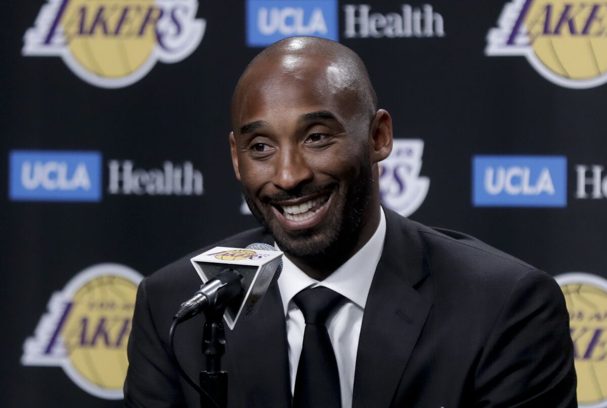 FILE - In this Dc. 18, 2017, file photo, former Los Angeles Laker Kobe Bryant talks during a news conference in Los Angeles. Kobe Bryant was a major proponent of women’s basketball, and his posthumous induction into the Basketball Hall of Fame this weekend will be alongside three legends of the women’s game in Kim Mulkey, Tamika Catchings and Barbara Stevens. (AP Photo/Chris Carlson, File)