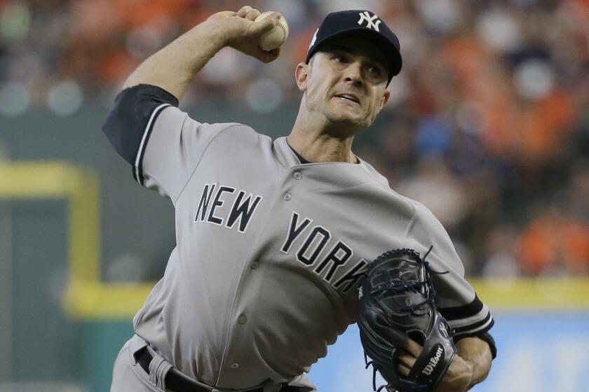 FILE - In this Saturday, Oct. 14, 2017 file photo, New York Yankees relief pitcher David Robertson throws during the seventh inning of Game 2 of baseball's American League Championship Series against the Houston Astros in Houston. Reliever David Robertson and the Philadelphia Phillies have agreed to a $23 million, two-year contact. The 33-year-old right-hander went 8-3 with a 3.23 ERA and five saves in 69 games last season for the New York Yankees. (AP Photo/Tony Gutierrez, File)