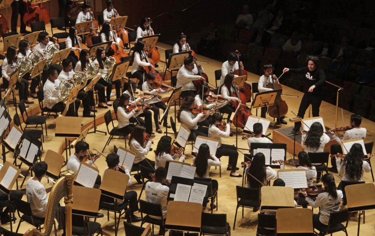 Gustavo Dudamel conducts a performance with Youth Orchestra Los Angeles at Walt Disney Concert Hall last May. Young musicians are the focus of the El Sistema program.