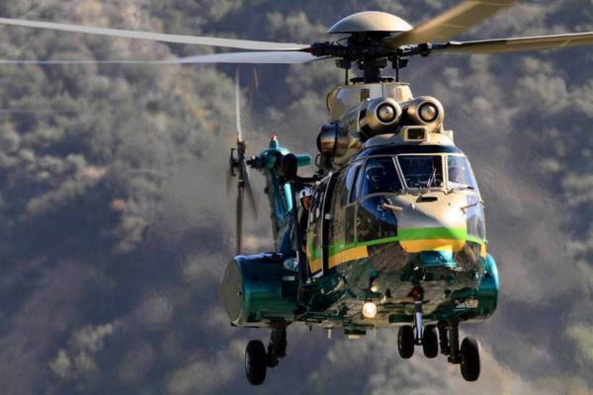 A Los Angeles County sheriff's helicopter assists in the search for two teen hikers in Holy Jim Canyon last month.