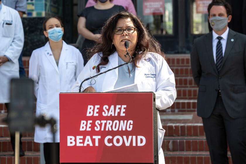 Dr. Maria Carriedo-Ceniceros of San Ysidro Health speaks during a press conference.