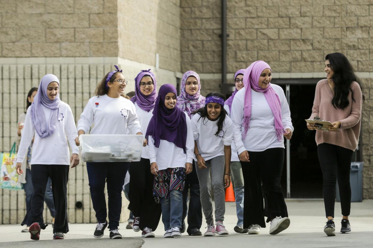 The FemSTEM team walks out of the gym after competing in the First Lego League robotics competition.