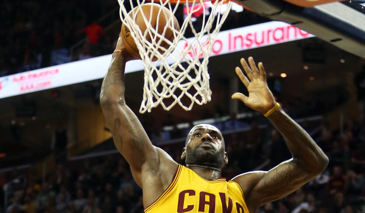 Cleveland Cavaliers forward LeBron James shoots for the basket during the first half against the Utah Jazz on Tuesday.