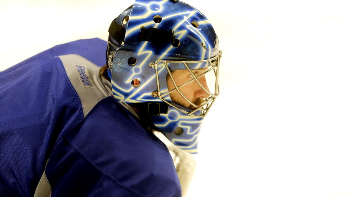 Lightning goalie Ben Bishop watches during a morning skate Wednesday in Chicago before Game 4, in which he did not play. He did not participate in Tampa Bay's practice on Friday.