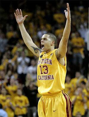 USC guard Daniel Hackett celebrates after making the tying basket in the final minute Saturday against Arizona.