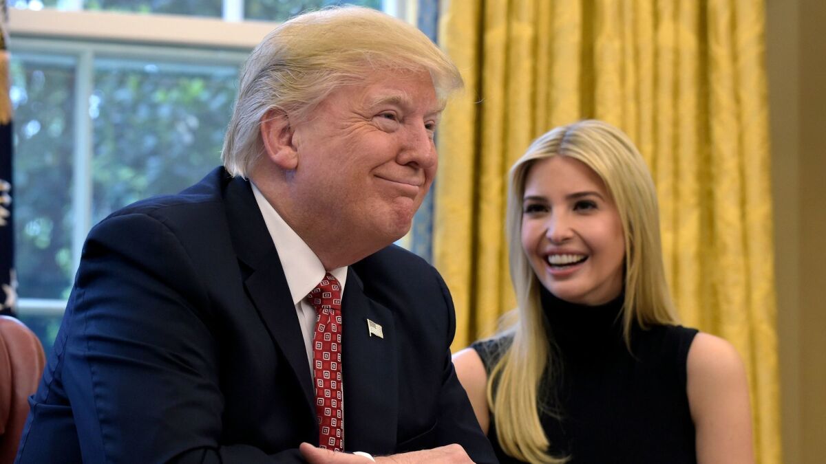 President Trump shares a laugh with his daughter, Ivanka Trump, in the Oval Office on April 24.