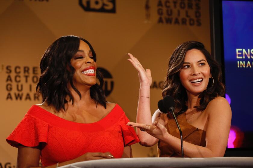 Niecy Nash, left, and Olivia Munn announce the nominations for the 24th Screen Actors Guild Awards in West Hollywood on Dec. 13, 2017.