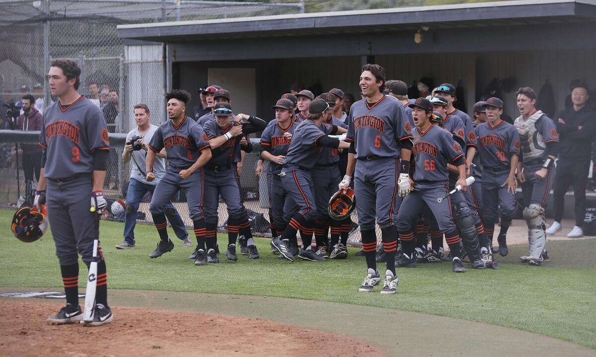Huntington Beach High players celebrate after Jake Vogel's solo home run in the sixth inning gave the Oilers a 2-1 lead in the quarterfinals of the CIF Southern Section Division 1 playoffs at Aliso Niguel on Friday.