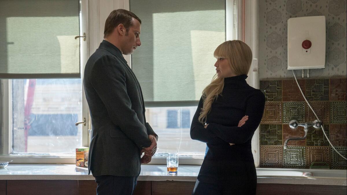 In this image released by Twentieth Century Fox, Matthias Schoenaerts and Jennifer Lawrence appear in a scene from "Red Sparrow."