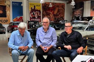 Three men sitting in directors chairs facing a camera