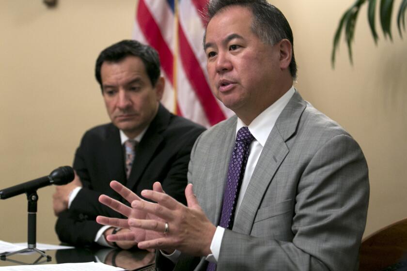 Assemblyman Phil Ting, D-San Francisco, right, chair of the Assembly budget committee discusses the state budget agreement reached between Gov. Jerry Brown and Democratic lawmakers, Tuesday, June 13, 2017, in Sacramento, Calif. Mitchell was accompanied Assembly Speaker Anthony Rendon, D-Paramount. (AP Photo/Rich Pedroncelli)