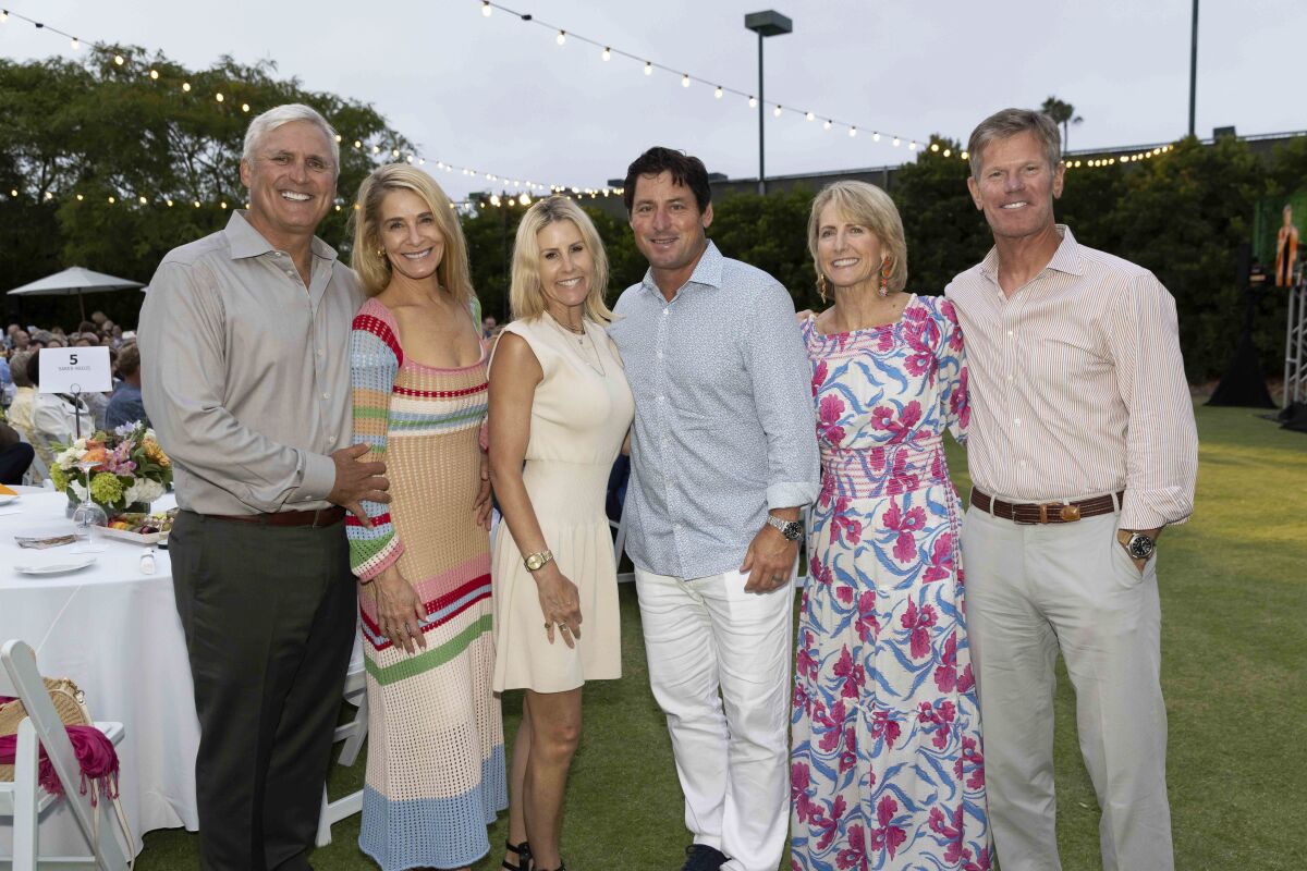 Cory and Lisa Adler, from left, Tracy and Kevin Murphy, Kyle and David Team raise $820,000 for KidWorks Santa Ana.