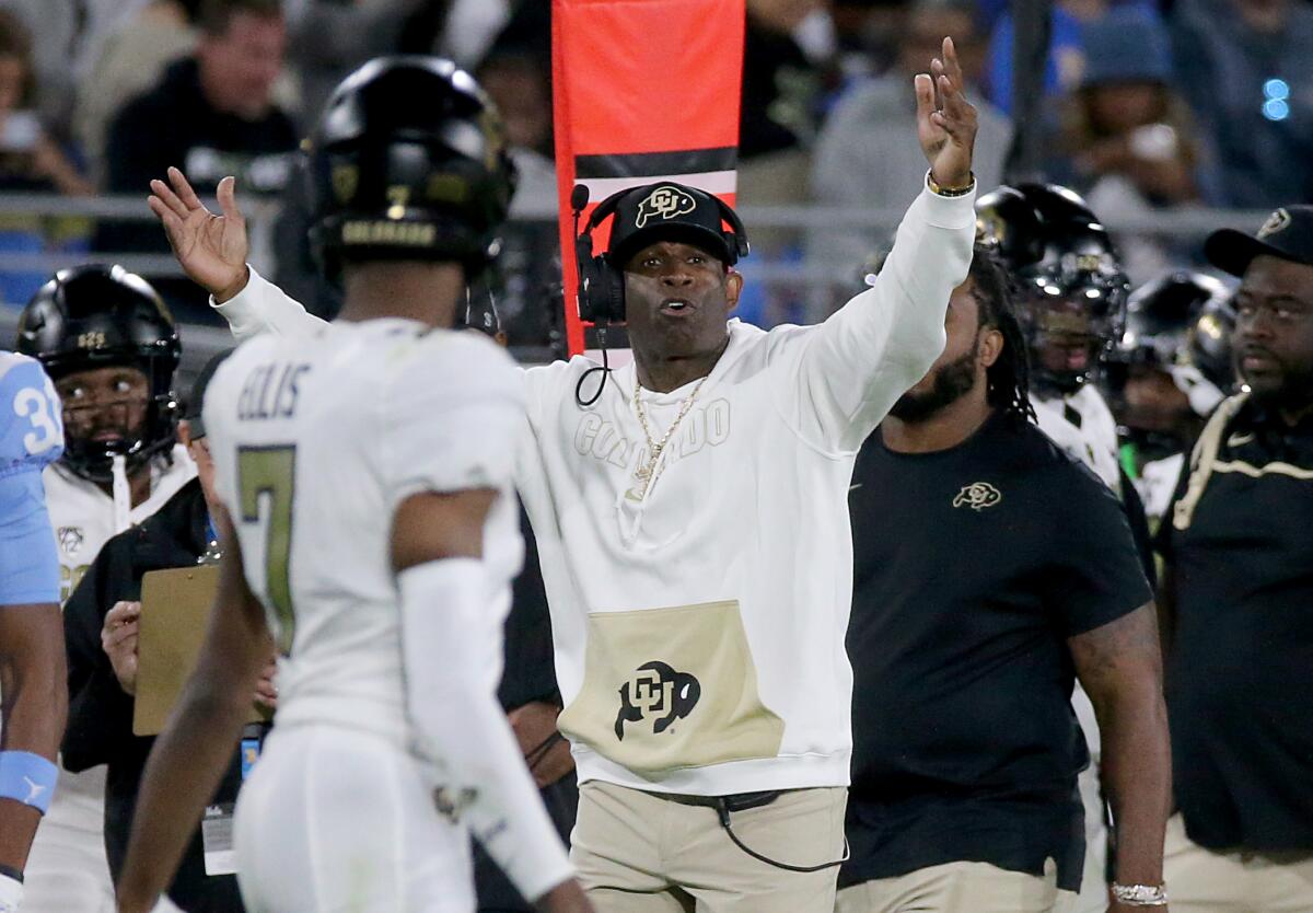Colorado coach Deion Sanders gestures during the second half against UCLA on Saturday.