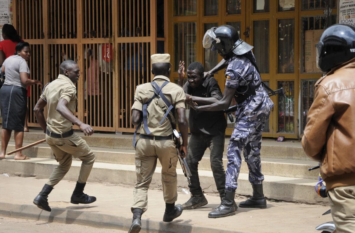 Ugandan security forces briefly beat, then detain a protester, who was demanding the release of jailed lawmaker and pop star Kyagulanyi Ssentamu, whose stage name is Bobi Wine, in downtown Kampala, Uganda.