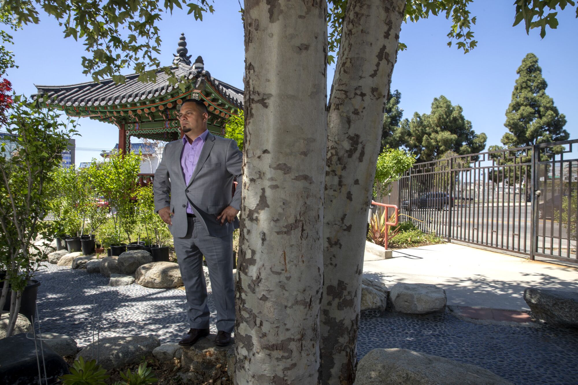 A man stands at the Korean Pavilion in Koreatown.