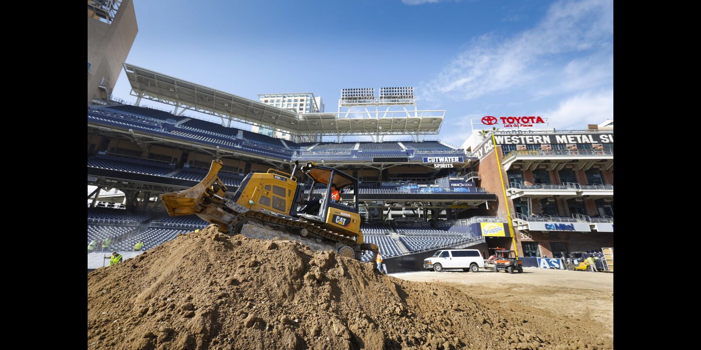 Billy Swapp operates a bulldozer to create jumps on the racetrack being created out of 26 million pounds of dirt on the baseball field at Petco Park, in preparation for the Monster Energy Supercross, to be held Saturday, February 2. Padres fans need not worry about the field. After the supercross is over, a brand new field will be installed, and ready for the 2019 season.