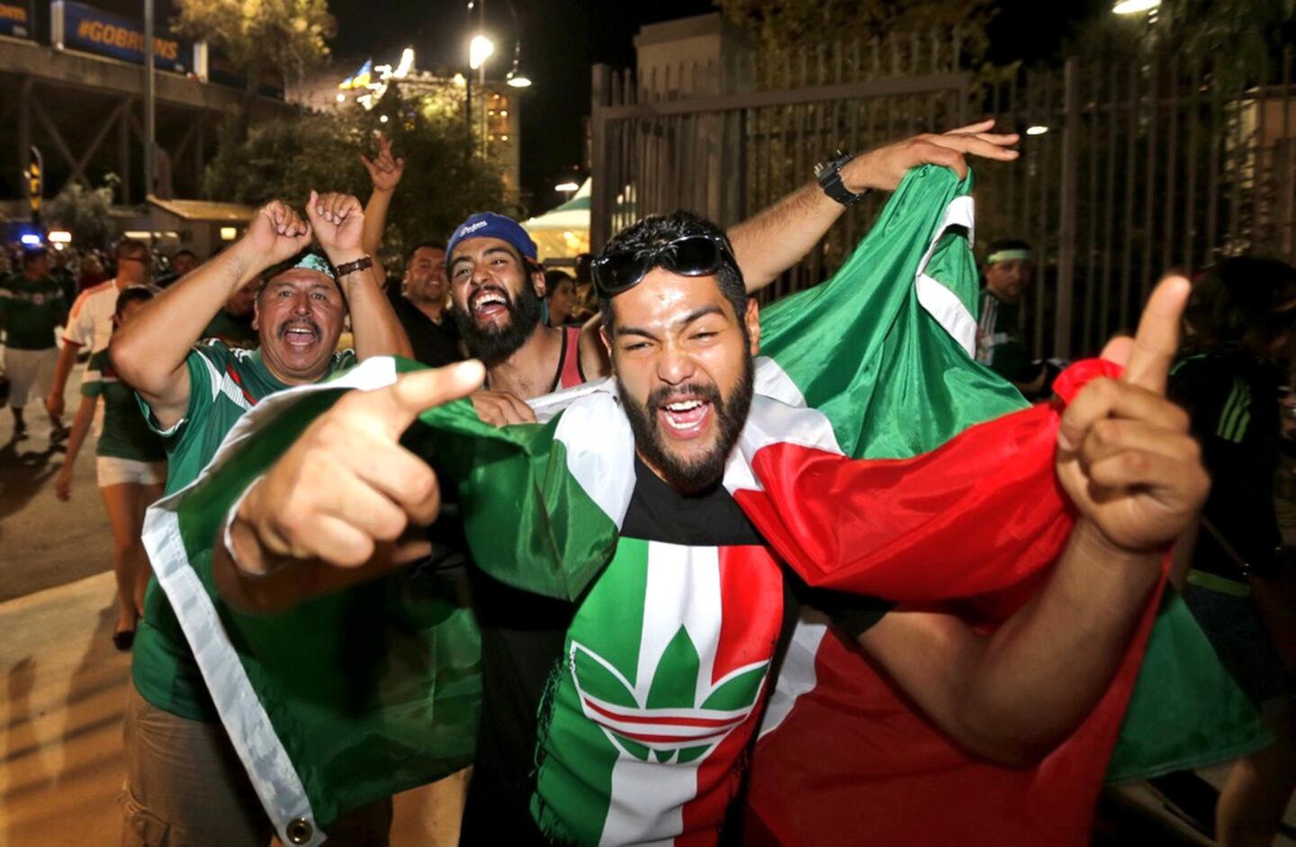 Mexico fans celebrate their team's victory over the U.S. at the Rose Bowl.