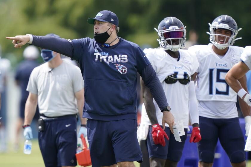 Tennessee Titans offensive coordinator Arthur Smith directs players during NFL football training camp Tuesday, Aug. 18, 2020, in Nashville, Tenn. (AP Photo/Mark Humphrey, Pool)