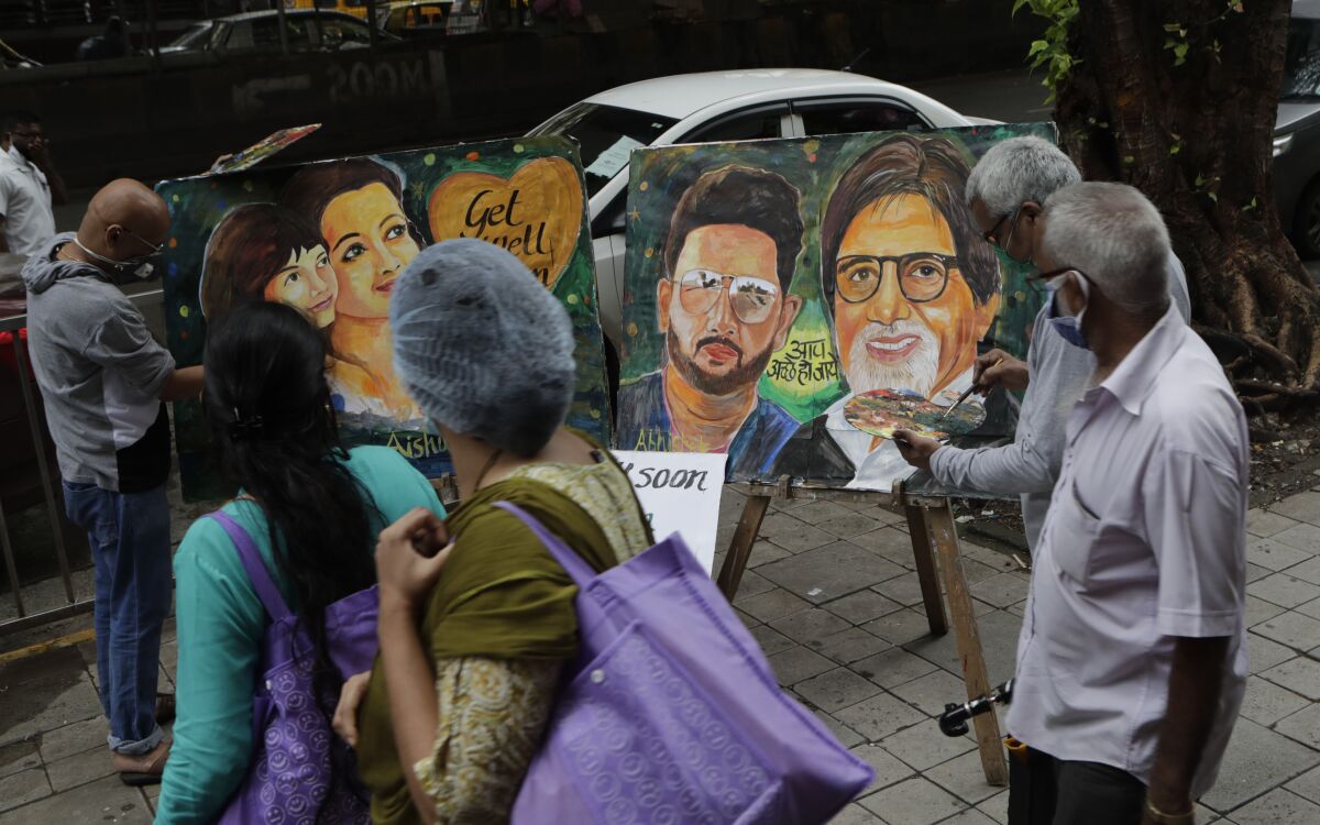 Students painted portraits of Bollywood star Amitabh Bachchan and his family who tested positive for the coronavirus in July
