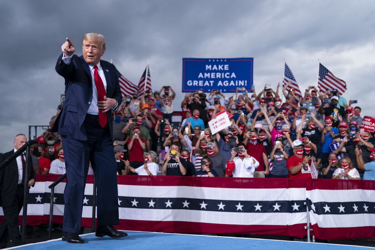President Donald Trump arrives to speak at a campaign rally at Smith Reynolds Airport, Tuesday, Sept. 8, 2020, in Winston-Salem, N.C. (AP Photo/Evan Vucci)