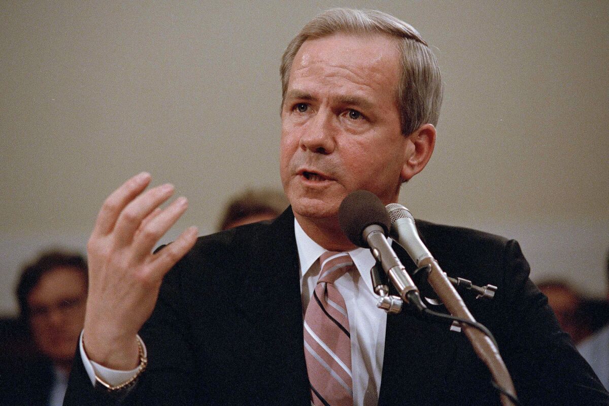 FILE - Former national security adviser Robert C. McFarlane gestures while testifying before the House-Senate panel investigating the Iran-Contra affair on Capitol Hill in Washington, May 13, 1987. McFarlane, a top aide to President Ronald Reagan who pleaded guilty to charges for his role in an illegal arms-for-hostages deal known as the Iran-Contra affair, died Thursday, May 12, 2022. He was 84. (AP Photo/Lana Harris, File)