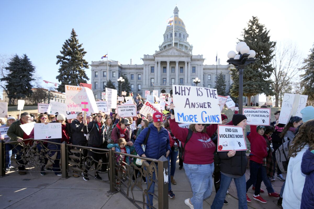 Students and parents from schools across Colorado take part in a rally, Friday, March 24, 2023, outside the State Capitol in Denver, calling for state lawmakers to consider gun control measures during the current legislative session. (AP Photo/David Zalubowski)