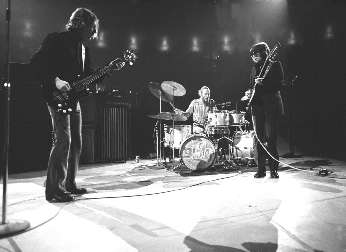 Cream is shown performing on its U.S. farewell tour at New York’s Madison Square Garden on Nov. 2, 1968, shortly after the trio’s late-October concert at the San Diego Sports Arena. Shown from left to right are Jack Bruce, Ginger Baker and Eric Clapton, who is the band’s only surviving member.