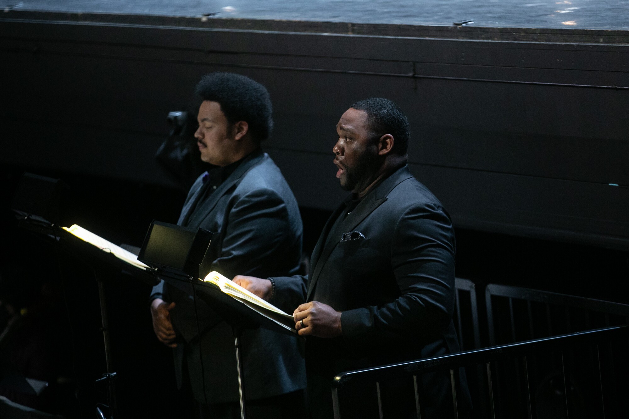 Two opera singers wearing black.