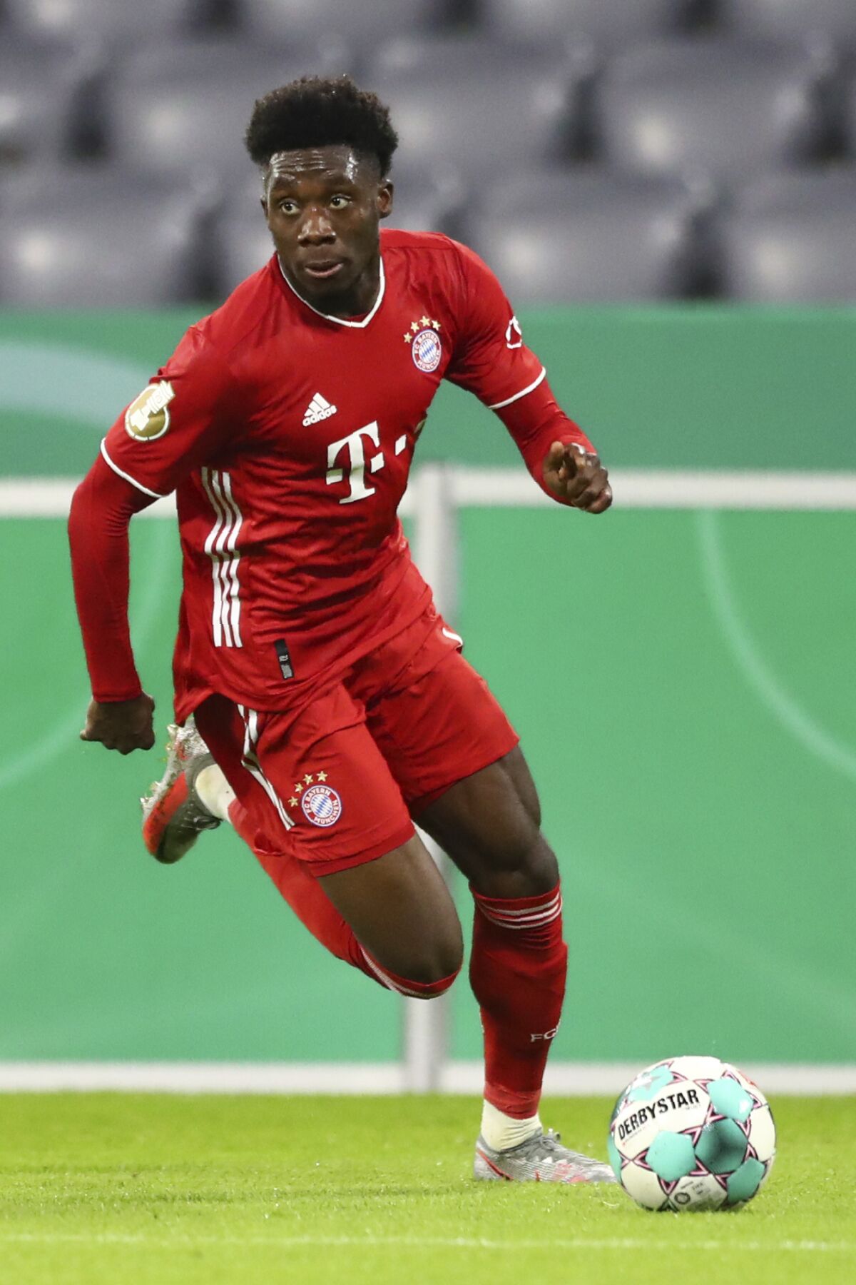 File- File picture taken Oct.15, 2020 shows Bayern's Alphonso Davies during the 1st round German Soccer Cup match between FC Bayern Munich and FC Duren, at the Allianz Arena in Munich, Germany. (AP Photo/ Matthias Schrader, file)