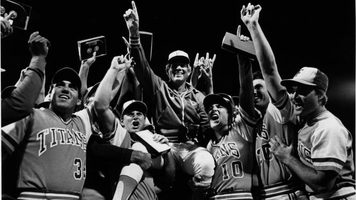 Augie Garrido is hoisted on the shoulders of his team after Cal State Fullerton's win over Texas in the title game of the 1984 College World Series.