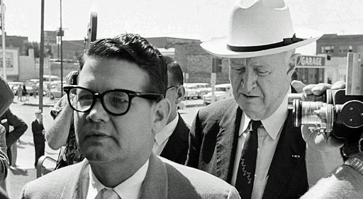 In this 1962 file photo, Billie Sol Estes, left, and his attorney, John Cofer, are shown arriving at the federal court house in El Paso.