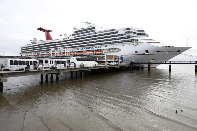 FILE - Passengers disembark from the Carnival Sunshine cruise ship Monday, March 16, 2020, in Charleston, S.C. Carnival Corp. said Monday, Jan. 11, 2021 its 2022 cruise bookings are running ahead of 2019 numbers, a good sign that guests will return once the pandemic has eased. The coronavirus has been devastating for the cruise industry, which had expected to welcome 30 million passengers worldwide in 2020. (AP Photo/Mic Smith, file)