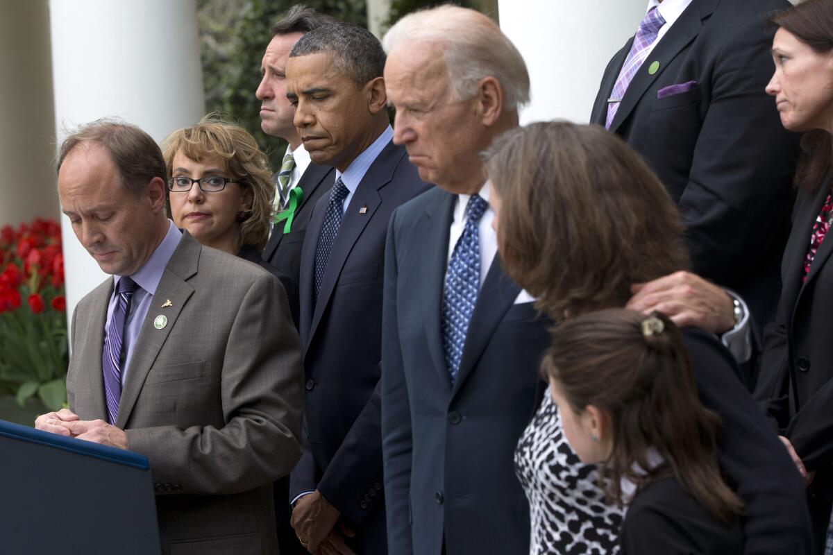 Mark Barden, left, who lost his son Daniel in the Newtown, Conn., school shooting, speaks at the White House.