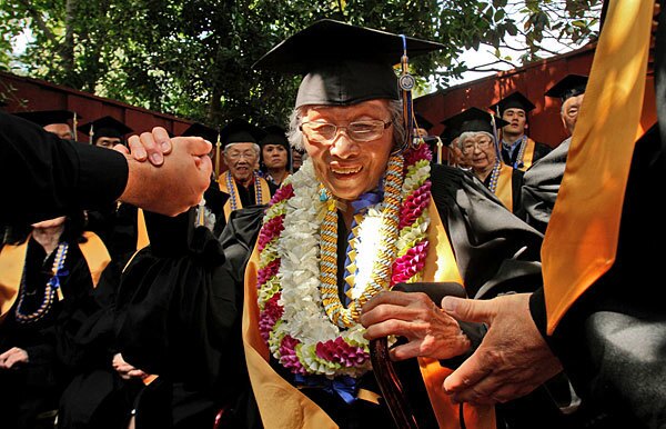 Sally Kusayanagi takes a group photo with other Japanese Americans who received honorary degrees at UCLA.