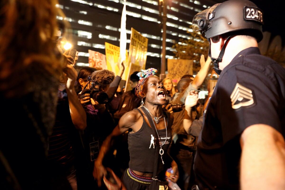 Beck led the LAPD through the turbulence of the Ferguson, Mo., protests and Black Lives Matter demonstrations. Above, protesters confront LAPD officers in 2014.
