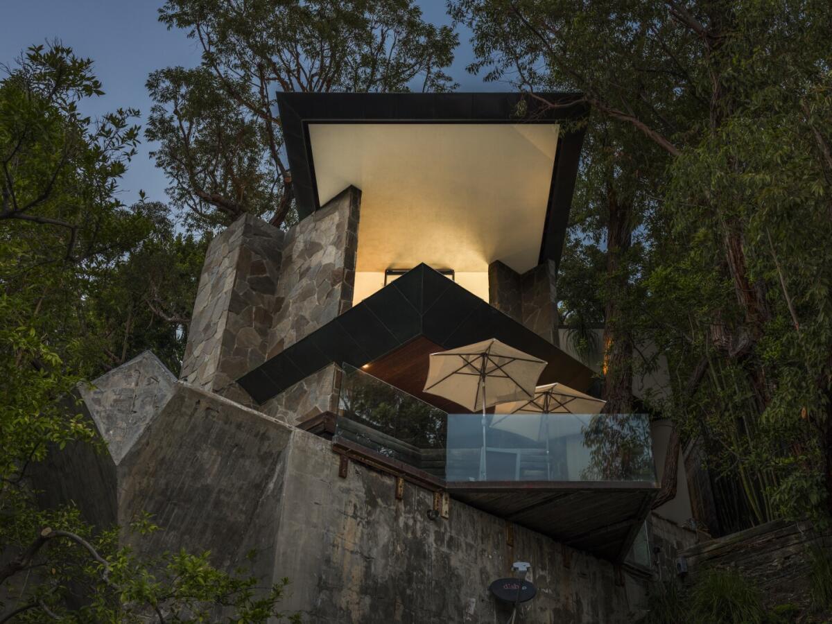 Walls of glass run from floor to ceiling in the John Lautner-designed Wolff House.