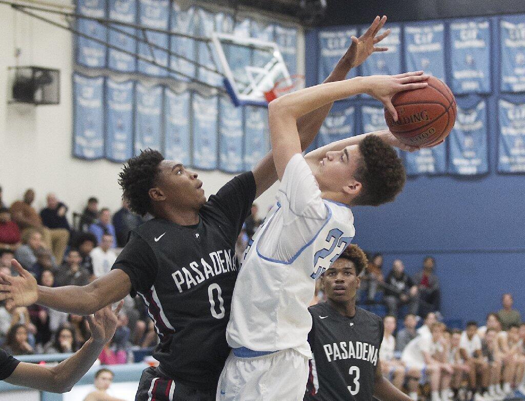 Corona del Mar High's Kevin Kobrine is fouled as he takes a shot against Pasadena's Bryce Hamilton in the quarterfinals of the CIF Southern Section Division 1A playoffs at Corona del Mar on Tuesday.