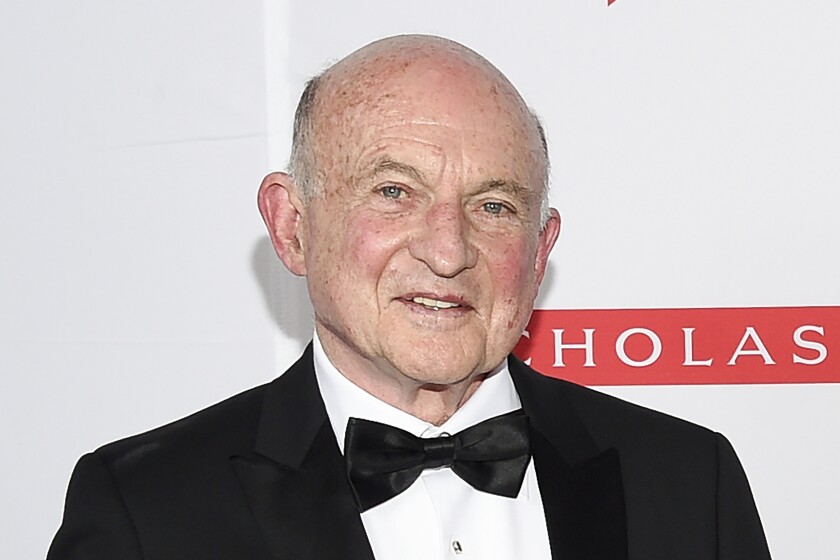Richard Robinson poses at the 2019 PEN America Literary Gala at the American Museum of Natural History in New York, in this Tuesday, May 21, 2019, file photo. Robinson, who as the longtime head of Scholastic Inc. presided over such bestsellers as J.K. Rowling's “Harry Potter” novels and Suzanne Collins' “The Hunger Games” series along with a wide range of educational materials, reading clubs and book fairs, has died. He was 84. The children's publishing giant announced that Robinson died Saturday, June 5, 2021, but did not immediately provide a cause. (Photo by Evan Agostini/Invision/AP)